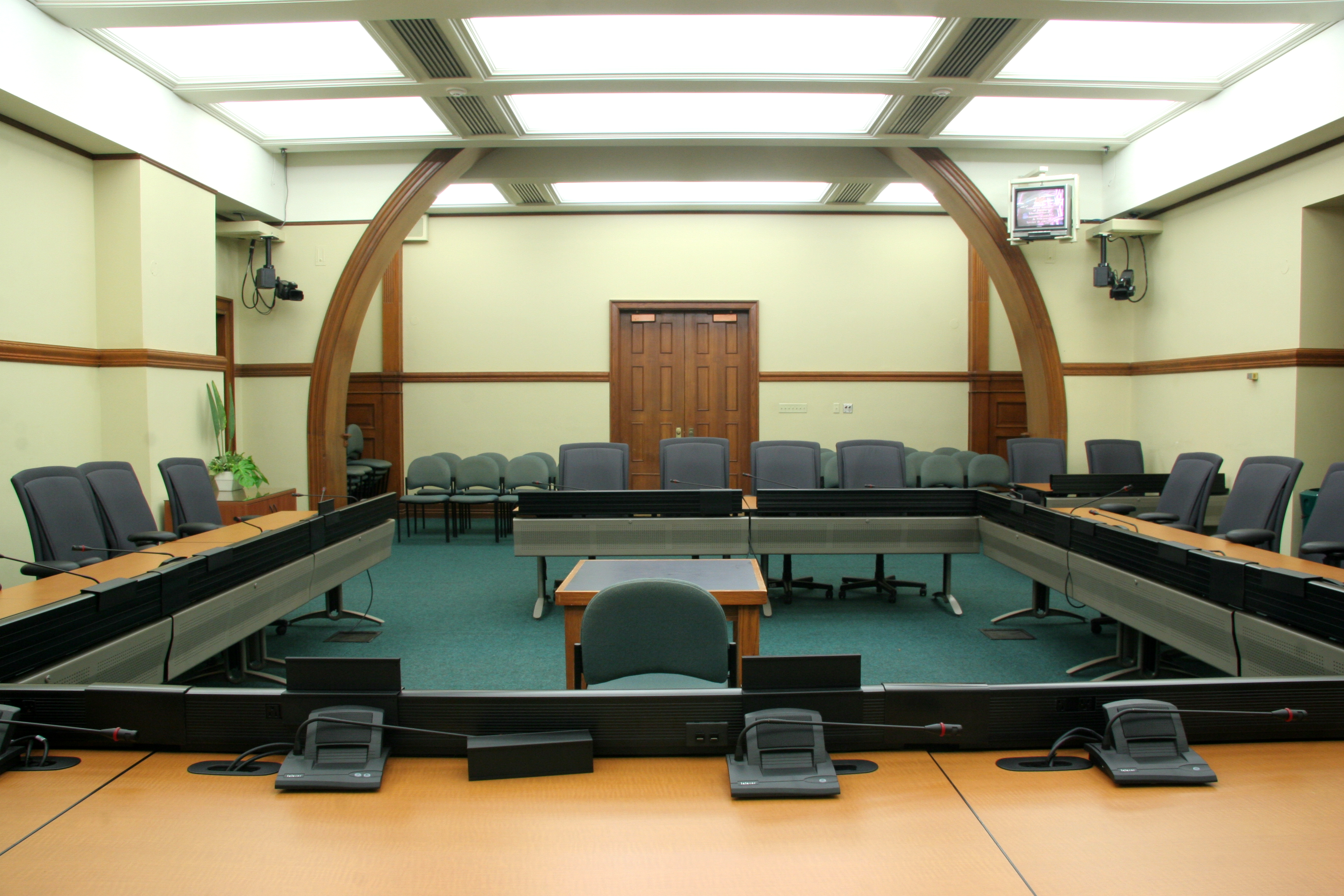 committee room with tables and chairs and no people