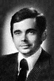 A headshot of John Roxborough Smith