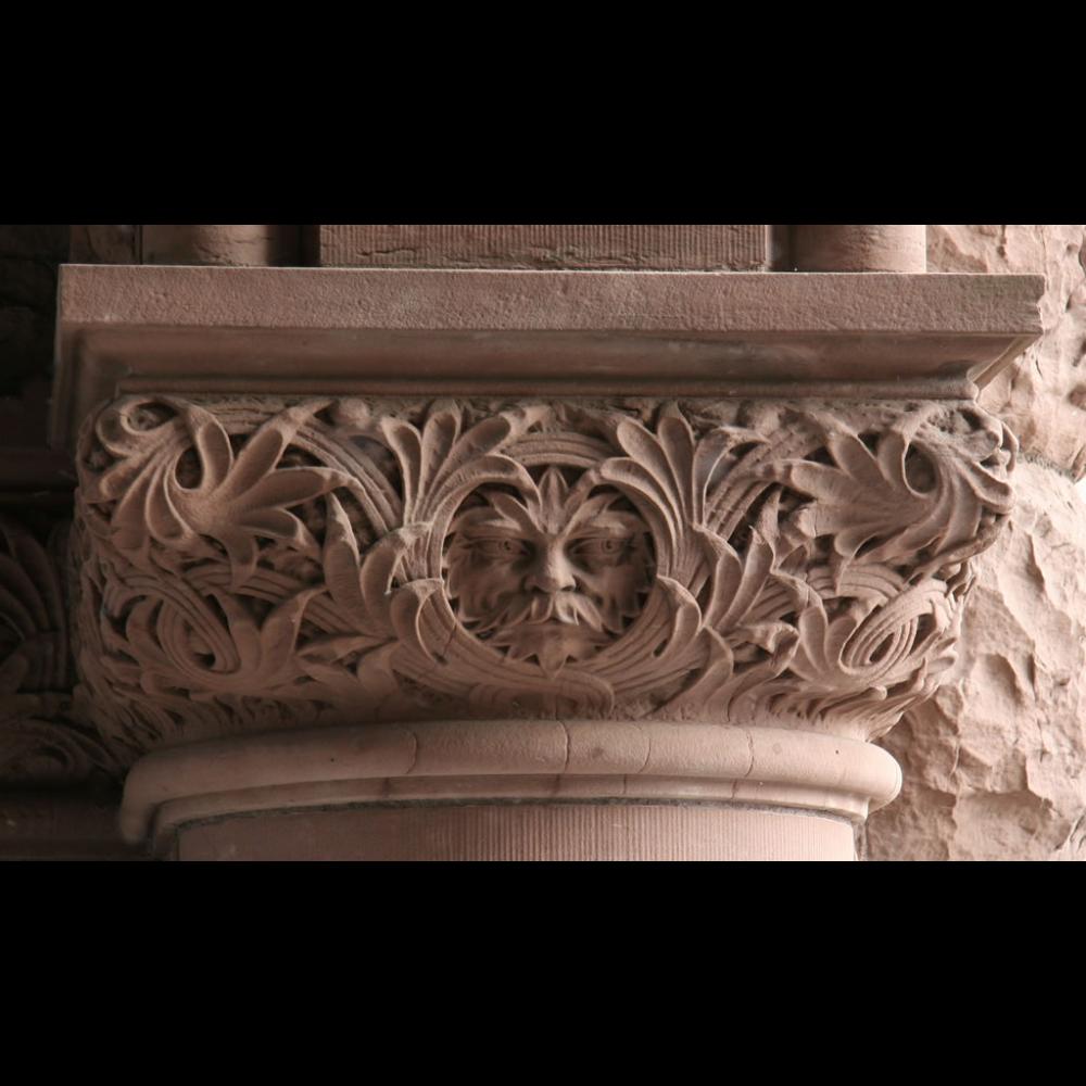 Face carved into a column by the east entrance of the Legislative Building. 