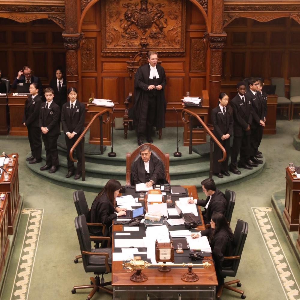 Picture of the Speaker, Pages and Clerks in the Chamber