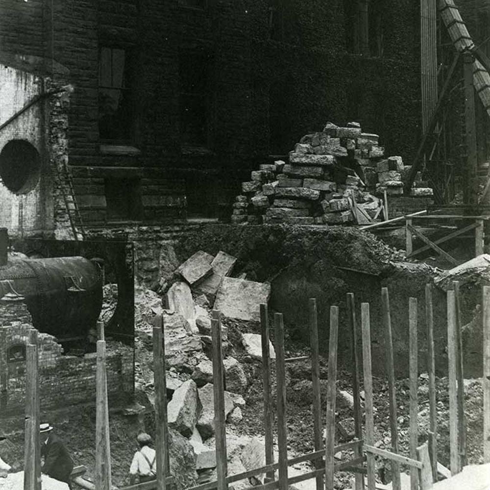 piles of bricks and rubble in black and white